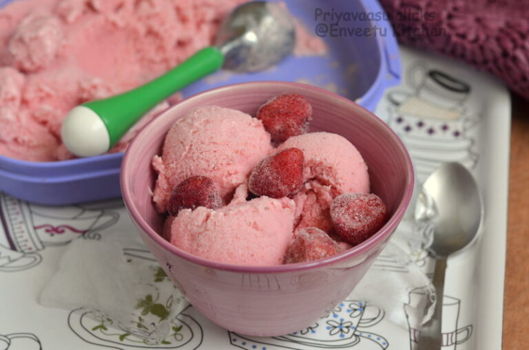 Strawberry frozen yogurt in a large bowl with berries on top