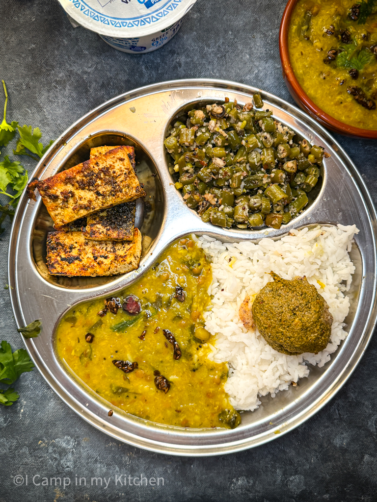 Simple vegetarian lunch with rice, potato peas dal and paneer