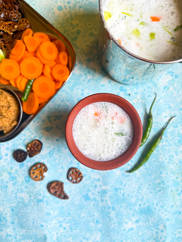 Neeraagaram served in a terracotta mug with accompaniments