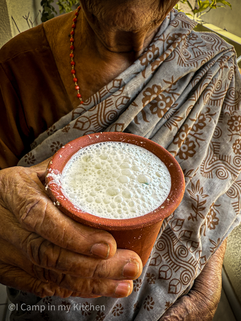 Amma with glass of fermented rice kanji