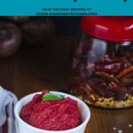 Bright and colorful beetroot thogayal in a white serving bowl