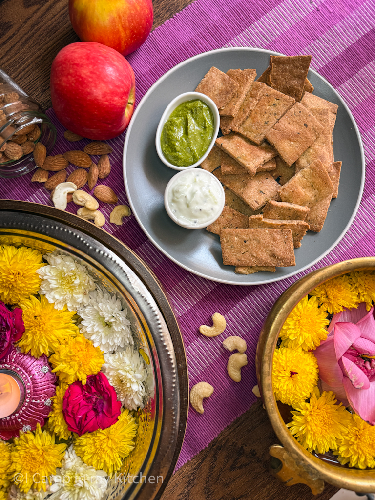 Baked mathri with flowers and fruits festive gift hamper