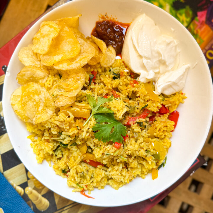 Easy capsicum rice served with curd, chips and pickle
