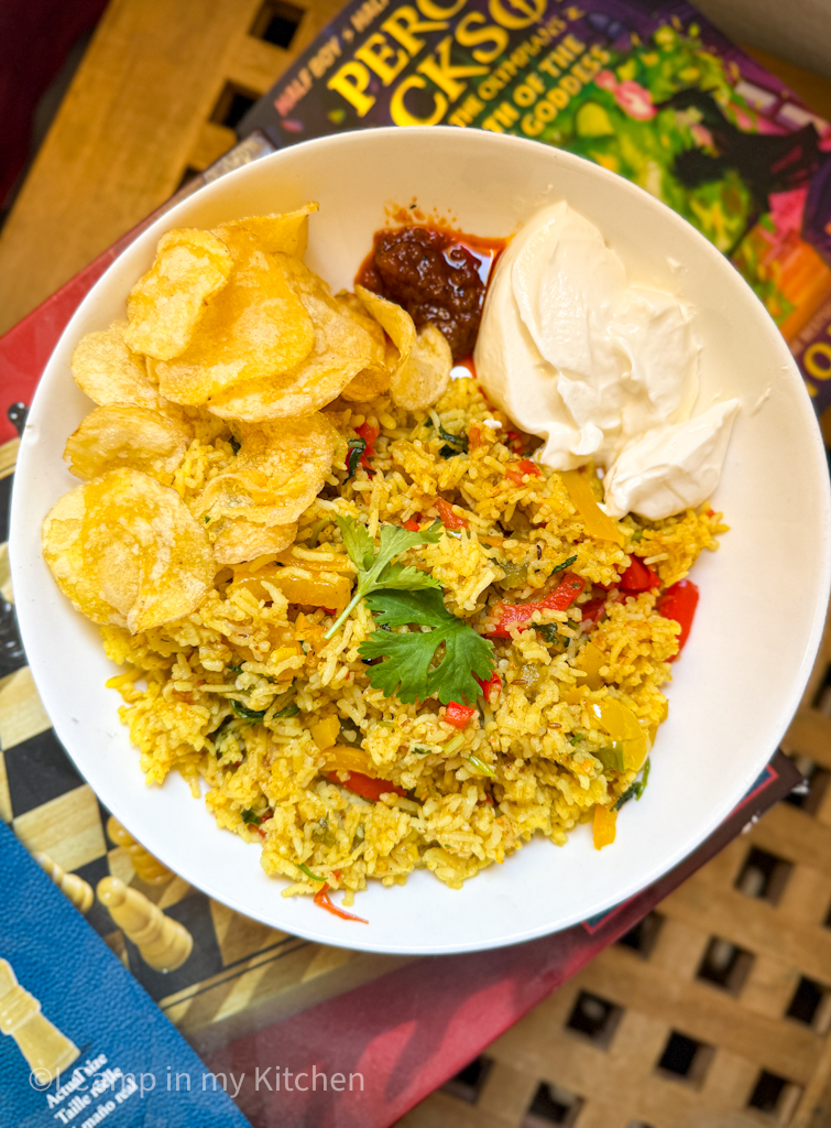 Easy capsicum rice served with curd, chips and pickle