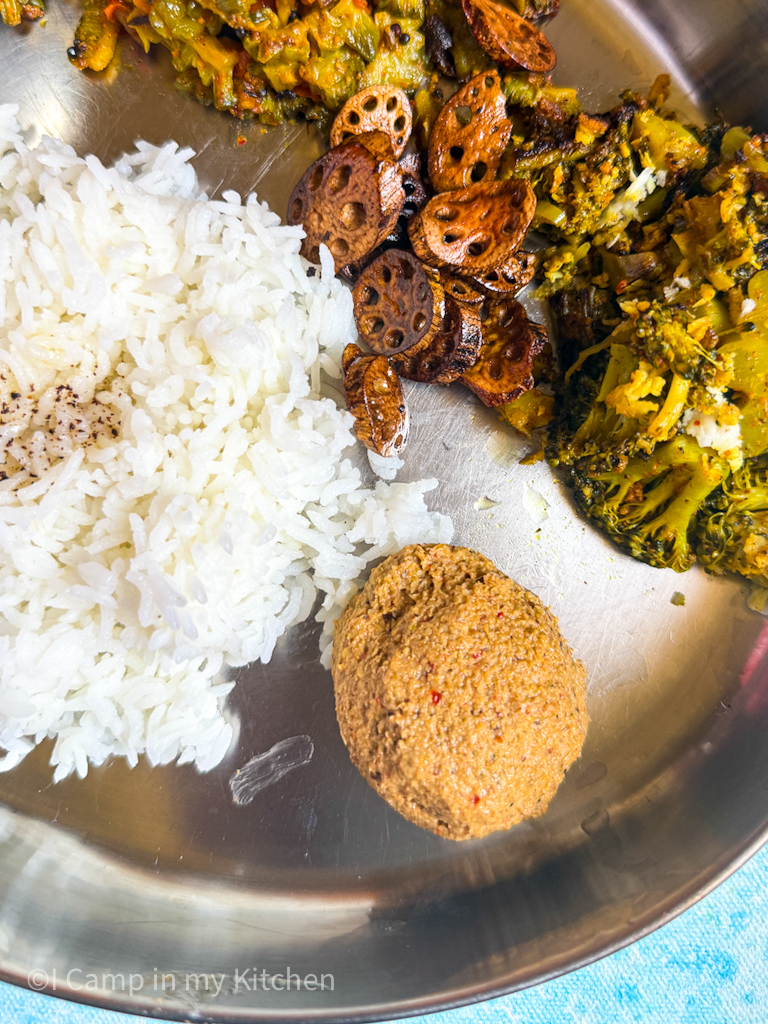 South indian lunch thali served with curry, kootu and thuvayal